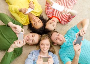 teenagers with their apps. shutterstock