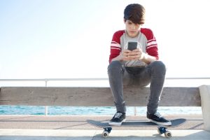 teenager with smartphone. shutterstock